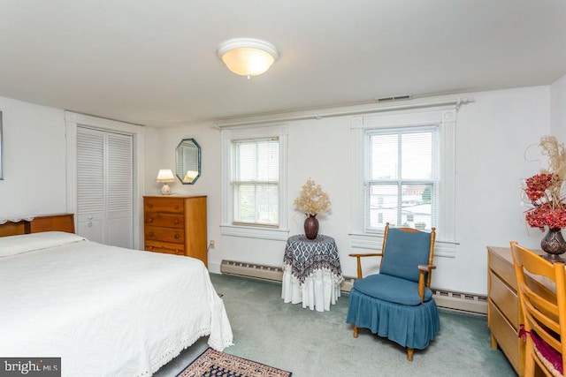 121 S Central St, Broadway, VA 22815 - carpeted bedroom featuring multiple windows, a baseboard heating unit, and a closet