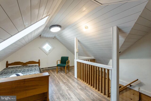 121 S Central St, Broadway, VA 22815 - bedroom with a skylight, vaulted ceiling, wood finished floors, and baseboards
