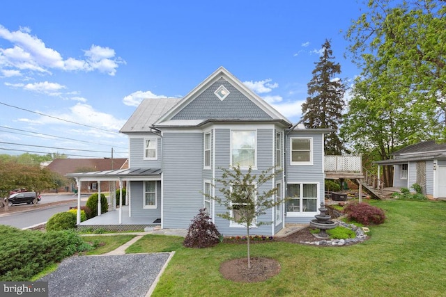 121 S Central St, Broadway, VA 22815 - view of front facade with a front lawn, a standing seam roof, metal roof, stairway, and a wooden deck
