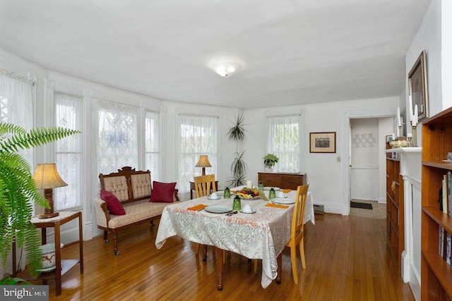 121 S Central St, Broadway, VA 22815 - dining room featuring hardwood / wood-style floors, a baseboard heating unit, and baseboards