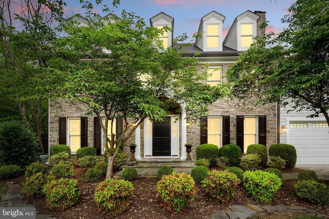 2125 Rampart Dr, Alexandria, VA 22308 - view of front facade with stone siding and a garage