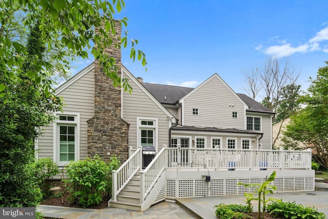 2125 Rampart Dr, Alexandria, VA 22308 - rear view of property with a deck, a chimney, and roof with shingles