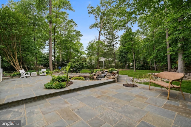 2125 Rampart Dr, Alexandria, VA 22308 - view of patio featuring view of scattered trees