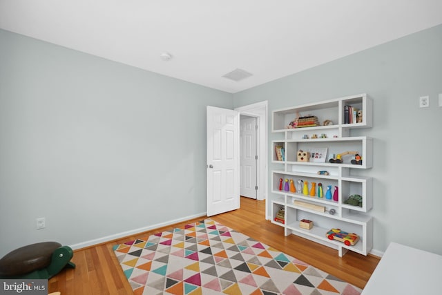 2125 Rampart Dr, Alexandria, VA 22308 - recreation room with wood finished floors and baseboards