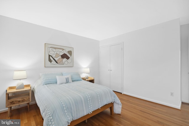 2125 Rampart Dr, Alexandria, VA 22308 - bedroom with a closet, wood finished floors, and baseboards