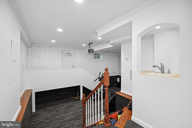2125 Rampart Dr, Alexandria, VA 22308 - hall with recessed lighting, baseboards, a sink, crown molding, and arched walkways