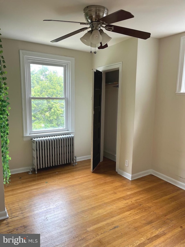 6709 N Lawrence St, Philadelphia, PA 19126 - unfurnished bedroom featuring radiator heating unit, light wood-type flooring, baseboards, a closet, and ceiling fan