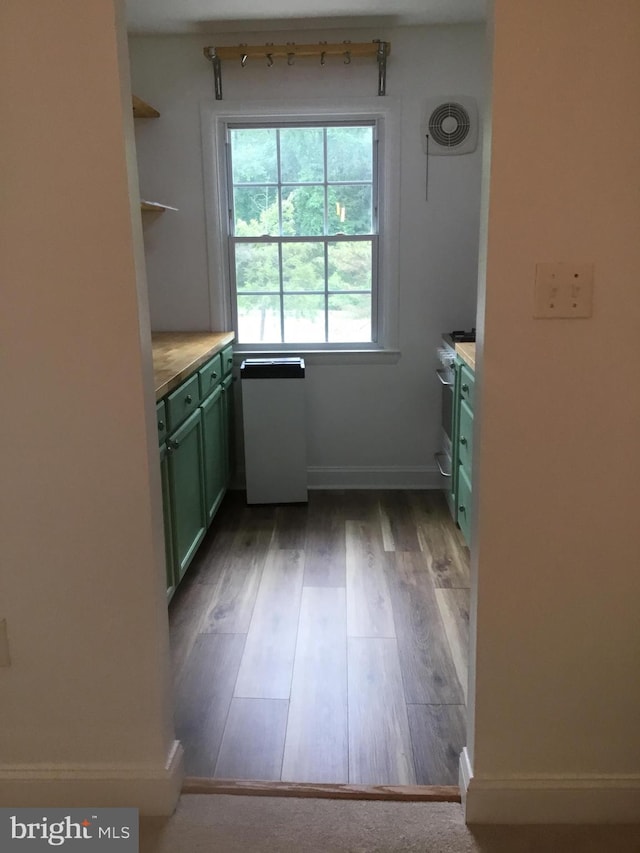 9449 Fairfax Blvd Unit 301, Fairfax, VA 22031 - kitchen featuring green cabinetry, gas range, wood finished floors, light countertops, and open shelves