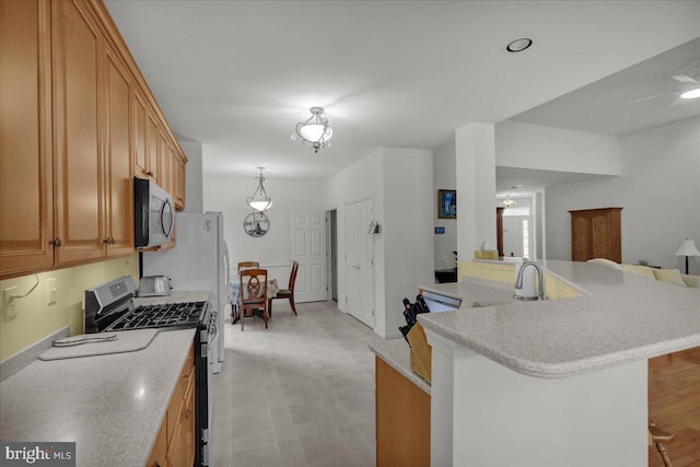 4304 Wheelwright Trl, Downingtown, PA 19335 - kitchen with stainless steel appliances, light countertops, a sink, and open floor plan