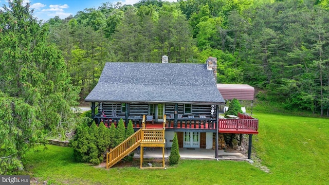 10263 Licking Creek Rd, Mifflintown, PA 17059 - back of property featuring a deck, a yard, french doors, and a view of trees