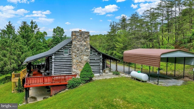 10263 Licking Creek Rd, Mifflintown, PA 17059 - view of green lawn with a detached carport, stairway, a view of trees, and a deck