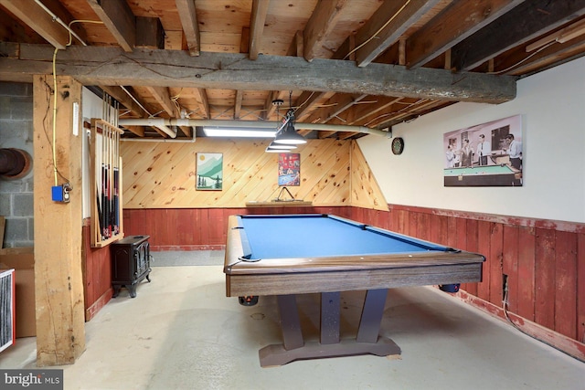 10263 Licking Creek Rd, Mifflintown, PA 17059 - playroom featuring concrete flooring, a wood stove, wooden walls, billiards, and a wainscoted wall