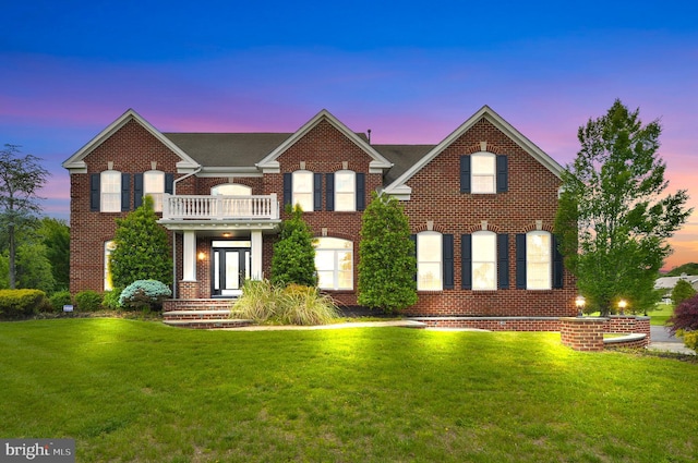 6 Applewood Ct, Hainesport, NJ 08036 - colonial house with a balcony, a front yard, and brick siding