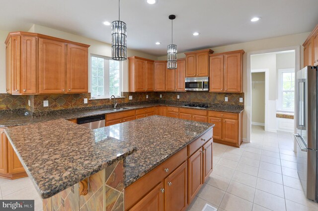 6 Applewood Ct, Hainesport, NJ 08036 - kitchen featuring appliances with stainless steel finishes, a sink, decorative backsplash, dark stone counters, and recessed lighting