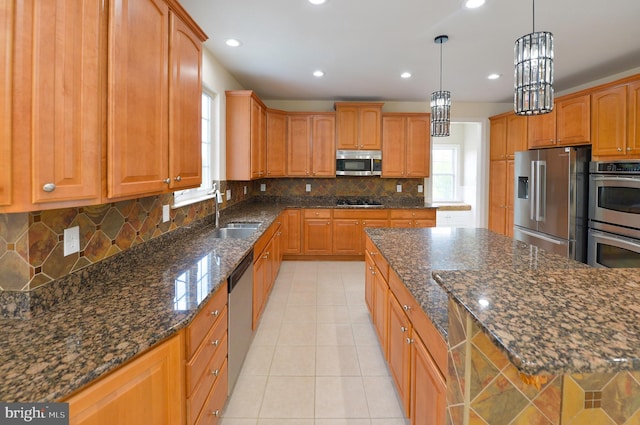 6 Applewood Ct, Hainesport, NJ 08036 - kitchen featuring appliances with stainless steel finishes, a sink, light tile patterned floors, dark stone counters, and backsplash