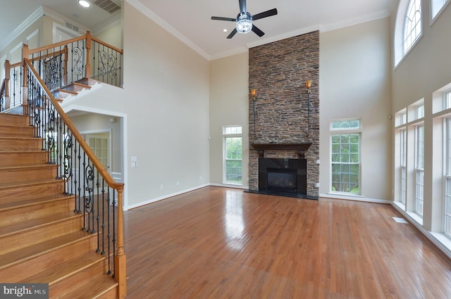 6 Applewood Ct, Hainesport, NJ 08036 - unfurnished living room featuring wood finished floors, plenty of natural light, ceiling fan, a towering ceiling, and stairway
