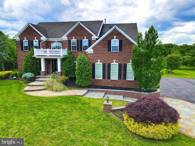 6 Applewood Ct, Hainesport, NJ 08036 - colonial-style house with brick siding, a balcony, and a front yard