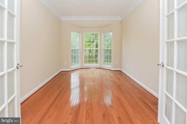 6 Applewood Ct, Hainesport, NJ 08036 - empty room with hardwood / wood-style flooring, crown molding, baseboards, and french doors