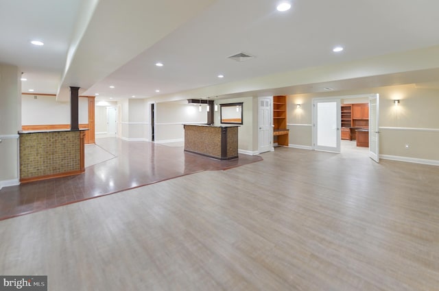 6 Applewood Ct, Hainesport, NJ 08036 - unfurnished living room featuring wet bar, baseboards, light wood-style flooring, and recessed lighting