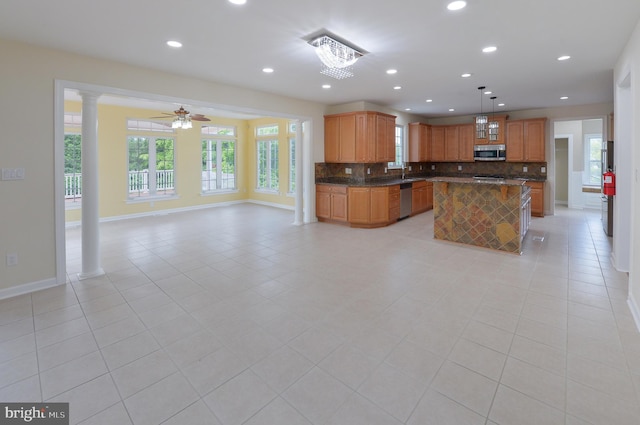 6 Applewood Ct, Hainesport, NJ 08036 - kitchen featuring dark countertops, stainless steel appliances, open floor plan, decorative backsplash, and baseboards