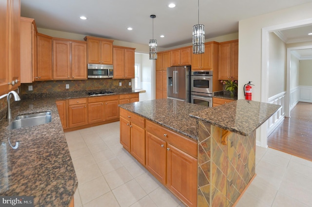 6 Applewood Ct, Hainesport, NJ 08036 - kitchen featuring stainless steel appliances, a sink, a center island, ornamental molding, and light tile patterned floors