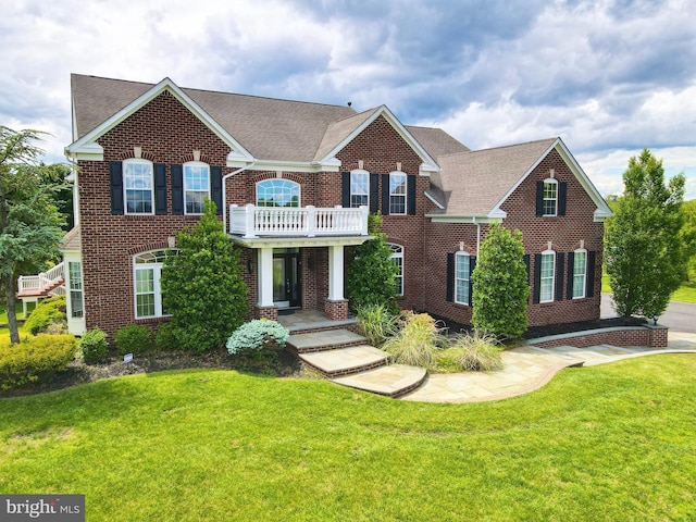 6 Applewood Ct, Hainesport, NJ 08036 - colonial inspired home featuring brick siding, a front yard, a shingled roof, and a balcony
