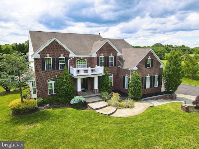 6 Applewood Ct, Hainesport, NJ 08036 - colonial inspired home featuring brick siding, a balcony, a front yard, and a shingled roof