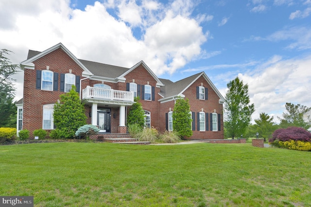 6 Applewood Ct, Hainesport, NJ 08036 - colonial inspired home with brick siding, a front lawn, and a balcony