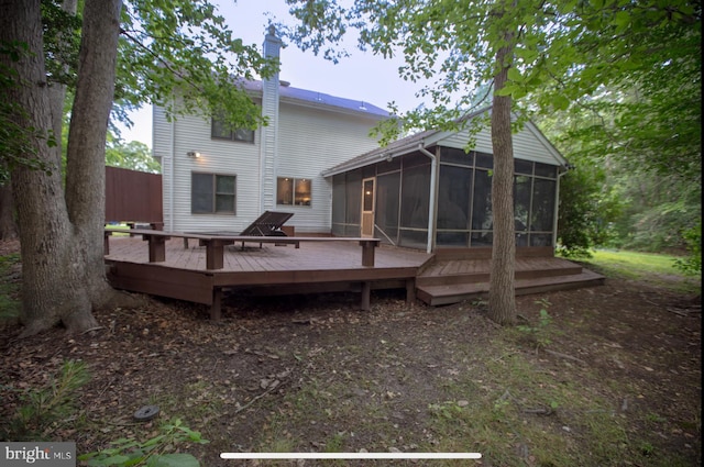 330 Troon Rd, Dover, DE 19904 - back of property featuring a sunroom, a deck, and a chimney