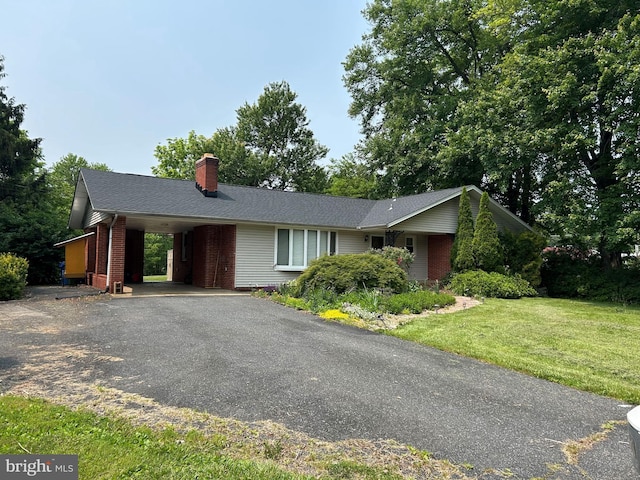 312 Whitaker Mill Rd, Fallston, MD 21047 - ranch-style home with a chimney, brick siding, driveway, a front lawn, and an attached carport