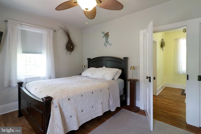 bedroom with wood finished floors, baseboards, and ceiling fan