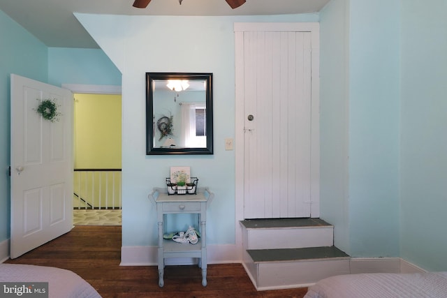 bedroom featuring wood finished floors and baseboards