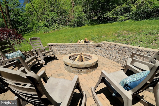 view of patio featuring a fire pit
