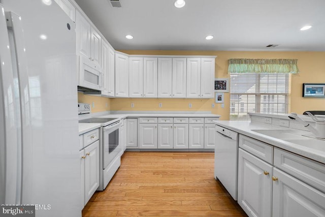 52 Whitewater Dr, Barnegat, NJ 08005 - kitchen featuring white appliances, white cabinetry, light countertops, light wood finished floors, and recessed lighting