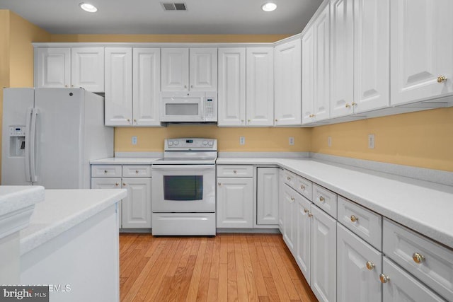 52 Whitewater Dr, Barnegat, NJ 08005 - kitchen featuring white appliances, recessed lighting, white cabinets, and light countertops