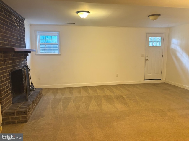 476 Colonial Ridge Ln, Arnold, MD 21012 - unfurnished living room featuring a fireplace, healthy amount of natural light, carpet flooring, and baseboards