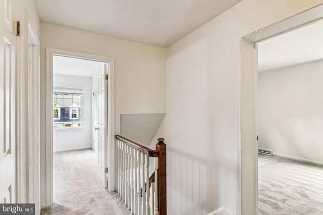476 Colonial Ridge Ln, Arnold, MD 21012 - hallway with light carpet, an upstairs landing, and baseboards