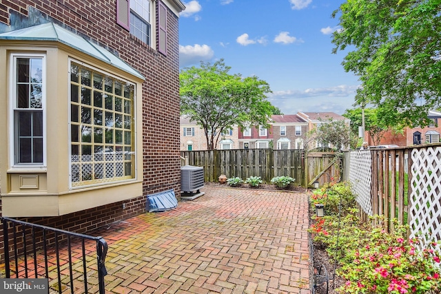 476 Colonial Ridge Ln, Arnold, MD 21012 - view of patio / terrace featuring central AC, a fenced backyard, and a residential view
