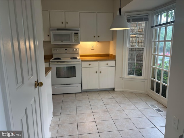 476 Colonial Ridge Ln, Arnold, MD 21012 - kitchen featuring white appliances, light tile patterned floors, white cabinets, pendant lighting, and baseboards