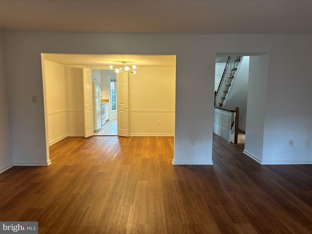 476 Colonial Ridge Ln, Arnold, MD 21012 - spare room with a chandelier, wood finished floors, baseboards, and stairs