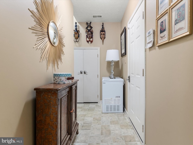2079 Stoneleigh Dr, Winchester, VA 22601 - laundry area with a textured ceiling