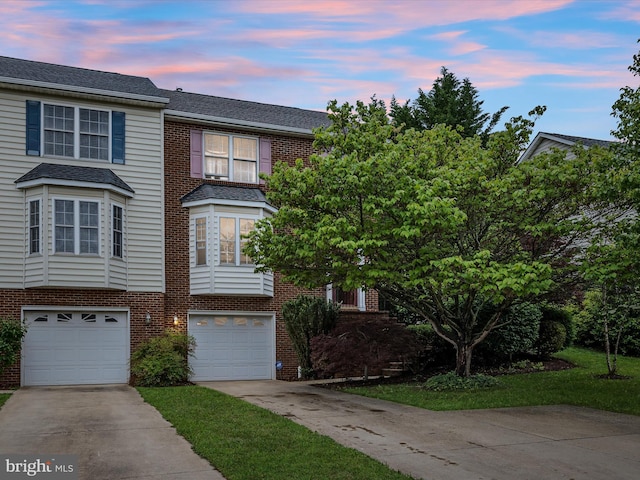 2079 Stoneleigh Dr, Winchester, VA 22601 - view of front of house with concrete driveway, a garage, brick siding, and a shingled roof