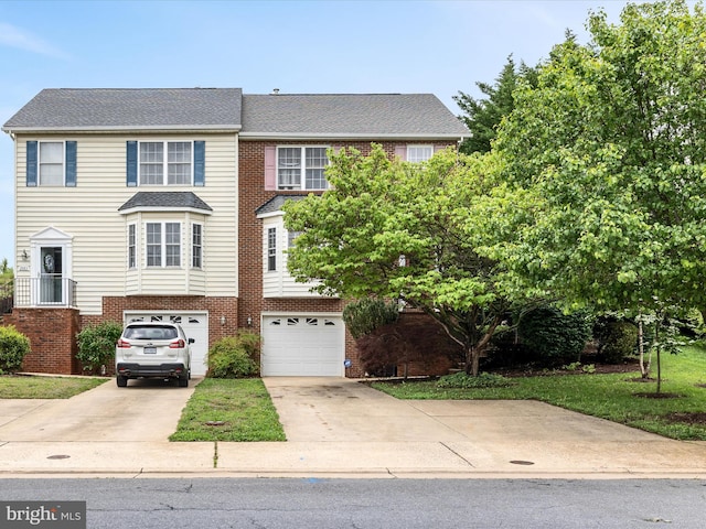 2079 Stoneleigh Dr, Winchester, VA 22601 - view of front of home featuring concrete driveway, a garage, and brick siding