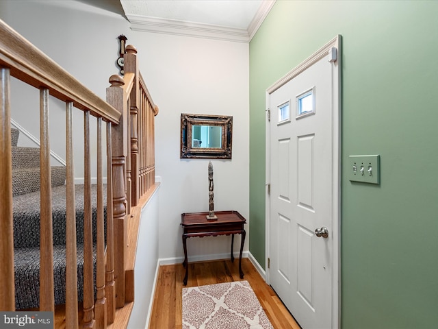 2079 Stoneleigh Dr, Winchester, VA 22601 - entrance foyer with ornamental molding, light wood-style flooring, baseboards, and stairway