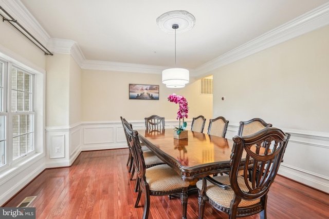 13330 Darnestown Rd, Darnestown, MD 20878 - dining space with crown molding, wood finished floors, and a wainscoted wall