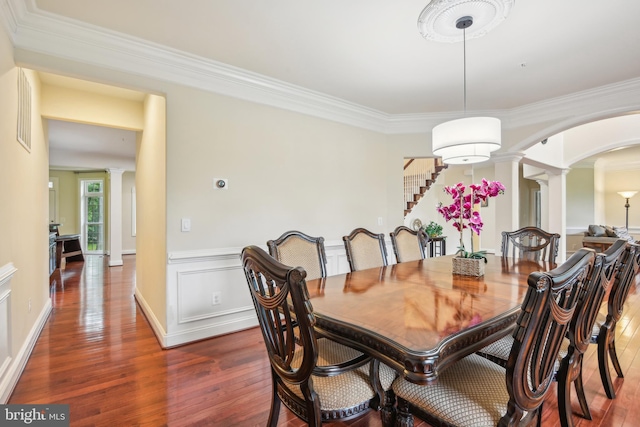 13330 Darnestown Rd, Darnestown, MD 20878 - dining room with decorative columns, arched walkways, wood finished floors, and ornamental molding