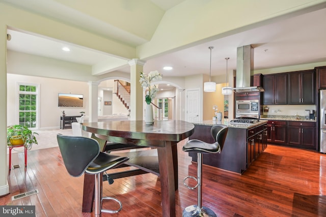 13330 Darnestown Rd, Darnestown, MD 20878 - kitchen with decorative columns, stainless steel appliances, island range hood, dark wood-type flooring, and recessed lighting