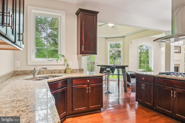 13330 Darnestown Rd, Darnestown, MD 20878 - kitchen featuring a sink, range hood, stainless steel gas cooktop, and light stone countertops