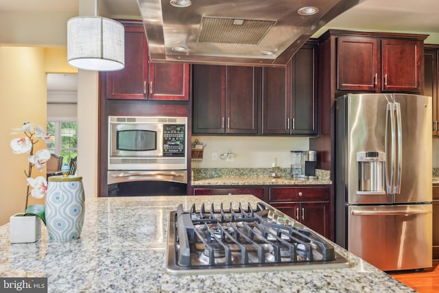 13330 Darnestown Rd, Darnestown, MD 20878 - kitchen featuring appliances with stainless steel finishes, dark brown cabinets, wall chimney range hood, light stone countertops, and recessed lighting