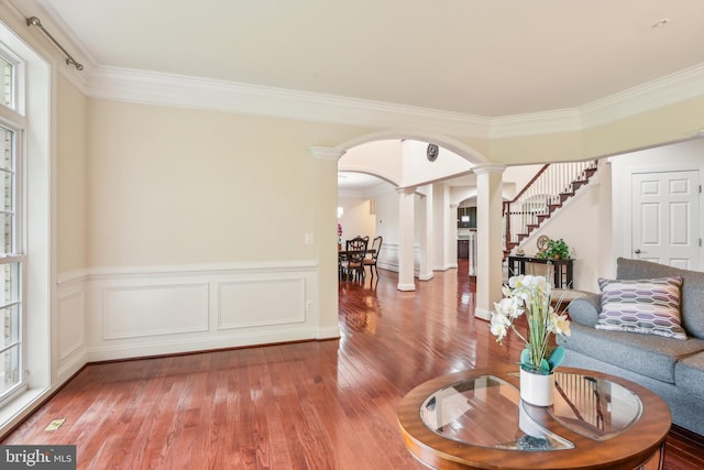 13330 Darnestown Rd, Darnestown, MD 20878 - living room with decorative columns, hardwood / wood-style floors, crown molding, arched walkways, and stairway